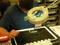 Casey begins working on the tray at UAF Lab using 3x magnification to pick the sample