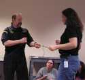 TREC teacher, Laurie Carr, gets tied up by Instructor, Brian Horner.   (Field Skills - Denver, CO.)