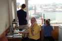 Sasha Zhulidov (yellow shirt), Amy Clapp, and Oliver Monson (holding the satellite phone out the window).