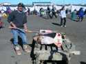 Gary Hopson is cutting a piece of whale blubber